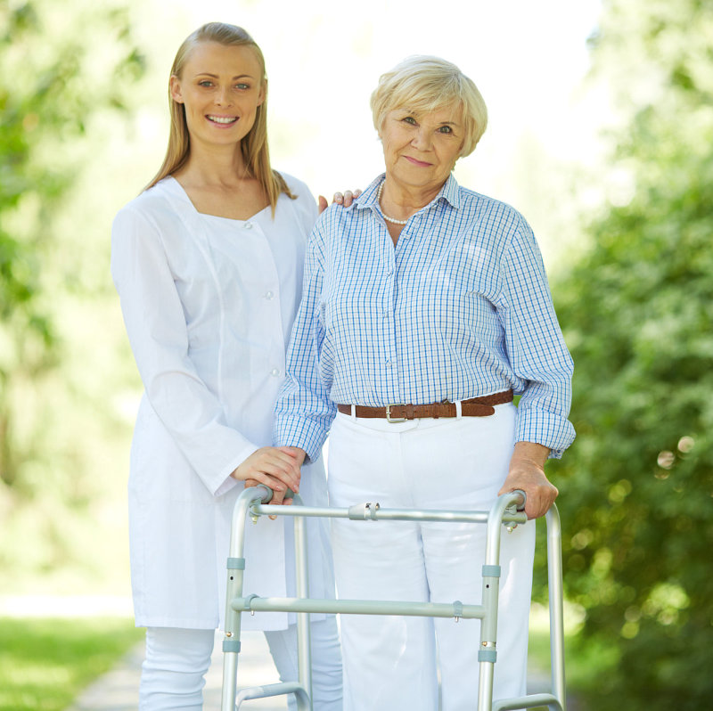 caregiver assisting patient in walking