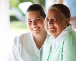 caregiver and patient smiling