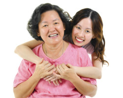 caregiver hugging patient